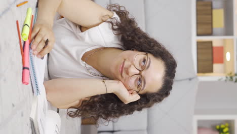 Vertical-video-of-Fun-Female-student-daydreaming.